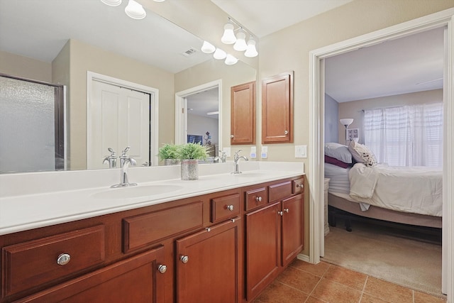 bathroom featuring tile patterned floors and vanity