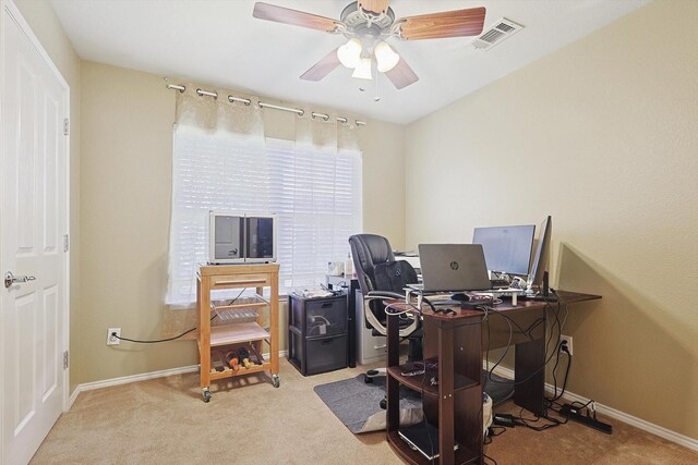 office with ceiling fan and light carpet