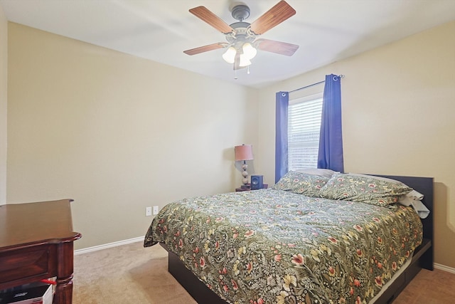 bedroom featuring light carpet and ceiling fan