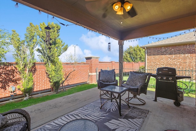 view of patio featuring ceiling fan and a grill