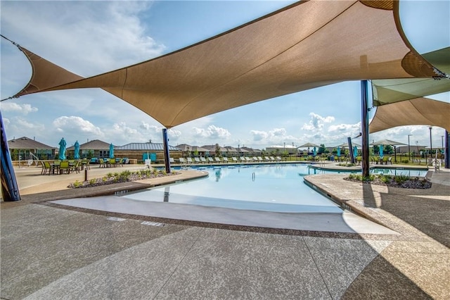 view of swimming pool featuring a patio