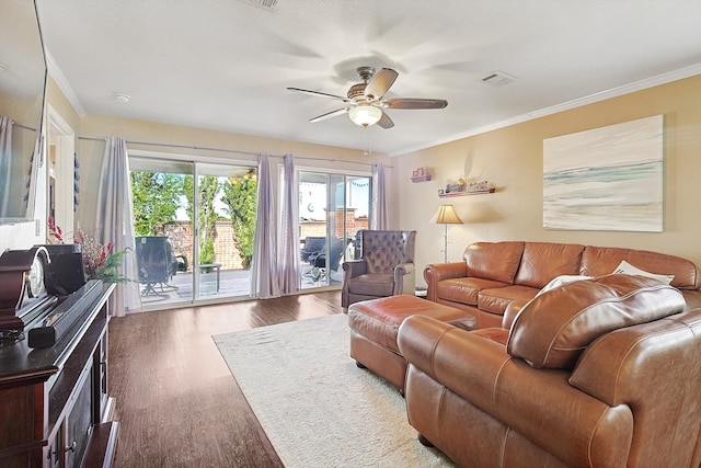 living room featuring crown molding, ceiling fan, and dark wood-type flooring