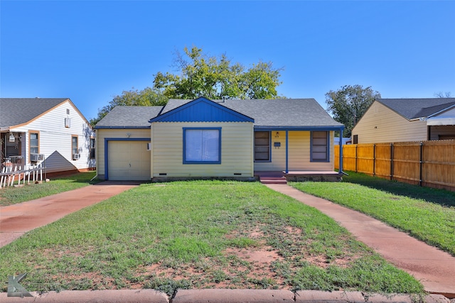 bungalow with a front yard, a porch, and a garage