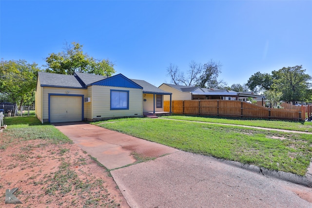 single story home featuring a front yard and a garage