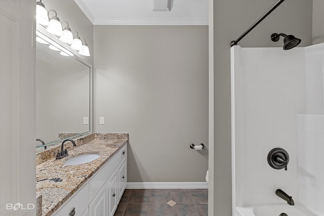 bathroom with tile patterned floors, crown molding, vanity, and washtub / shower combination