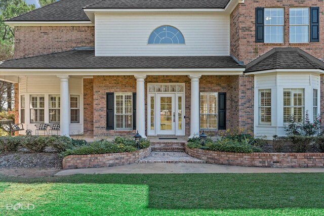 property entrance with covered porch