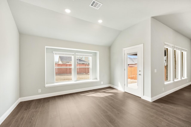 interior space featuring visible vents, dark wood finished floors, recessed lighting, baseboards, and vaulted ceiling