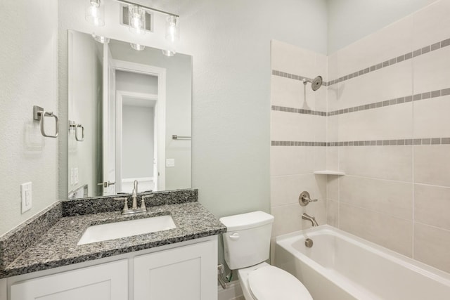 bathroom featuring visible vents, vanity, toilet, and washtub / shower combination