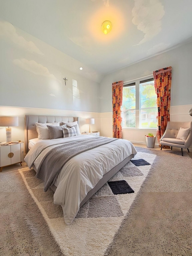 bedroom featuring carpet and lofted ceiling