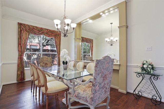 dining room featuring dark hardwood / wood-style floors, a healthy amount of sunlight, and a notable chandelier