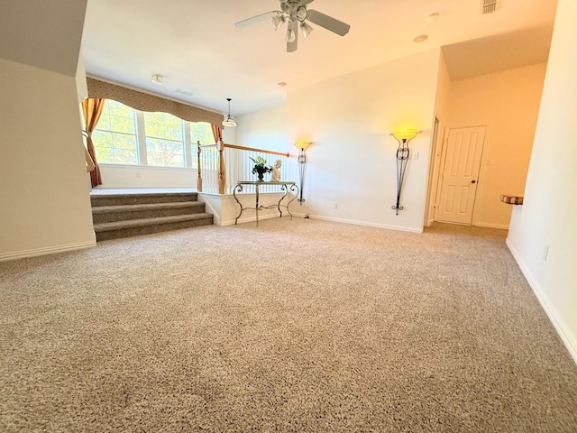 spare room featuring ceiling fan and ornamental molding