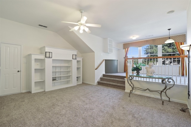 carpeted living room featuring ceiling fan