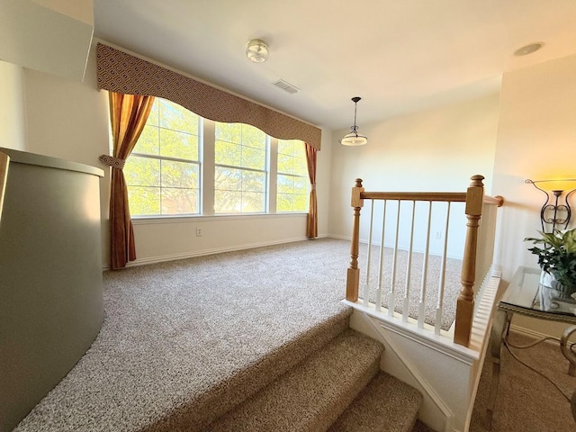 carpeted living room featuring ceiling fan and lofted ceiling