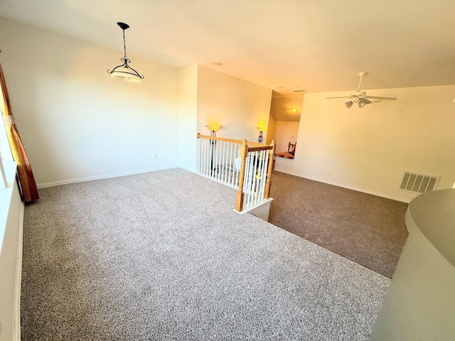 stairs featuring carpet flooring