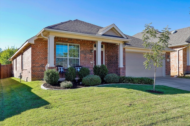 single story home featuring covered porch, a garage, and a front lawn