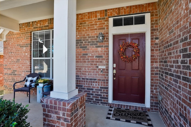 property entrance with covered porch