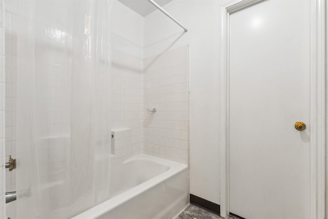 bathroom with shower / washtub combination