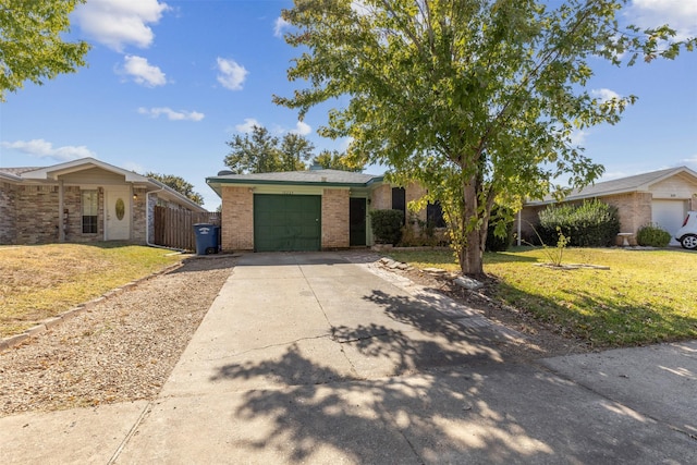 ranch-style house featuring a garage and a front lawn