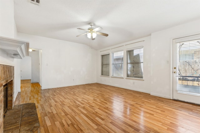 unfurnished living room with a fireplace, light hardwood / wood-style flooring, and ceiling fan