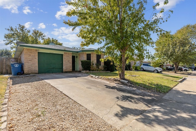 ranch-style house featuring a garage and a front lawn