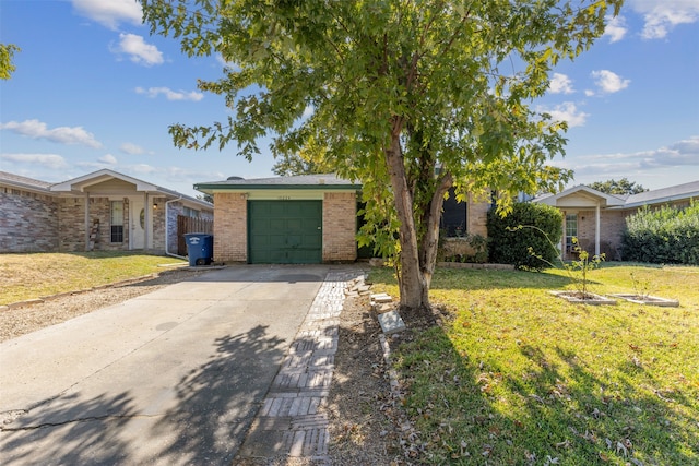 ranch-style home featuring a garage and a front lawn