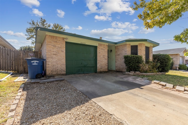 ranch-style house featuring a garage