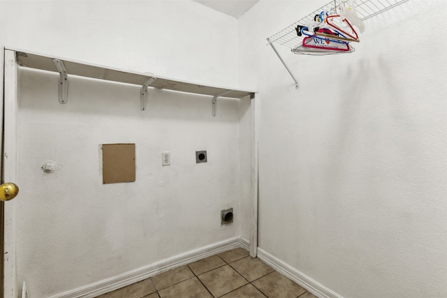 clothes washing area featuring light tile patterned floors and hookup for an electric dryer