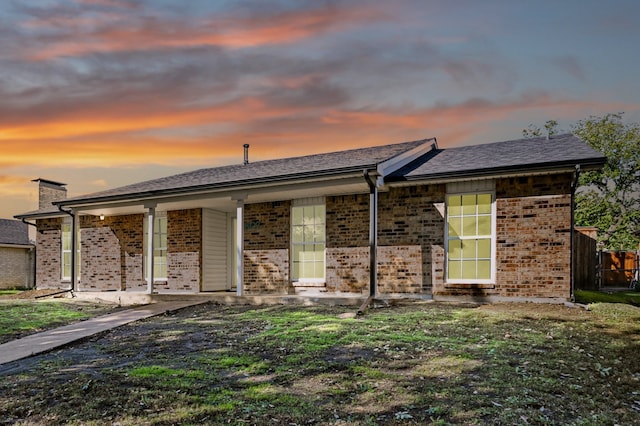 view of front of house with a lawn