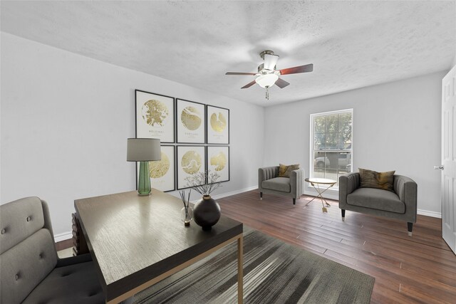 living room featuring a fireplace, vaulted ceiling with beams, dark hardwood / wood-style flooring, and ceiling fan