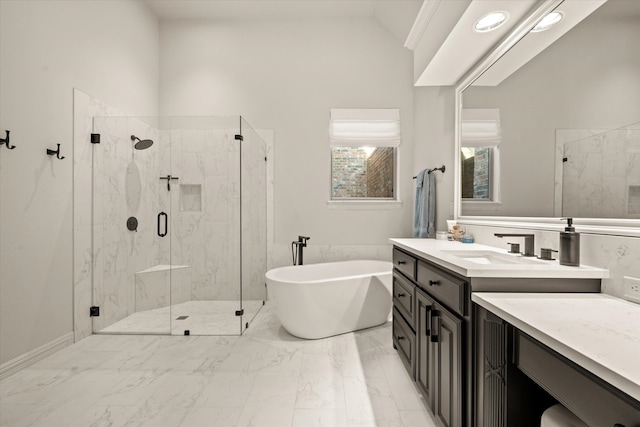 bathroom featuring vanity, vaulted ceiling, and independent shower and bath