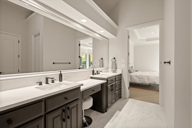 bathroom featuring crown molding and vanity