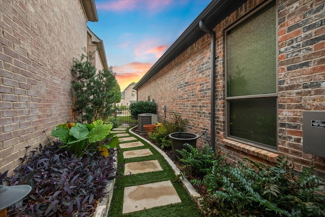 yard at dusk with central AC