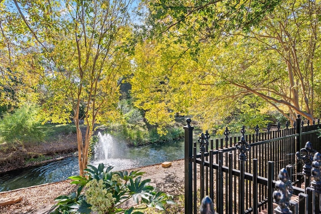 view of gate with a water view