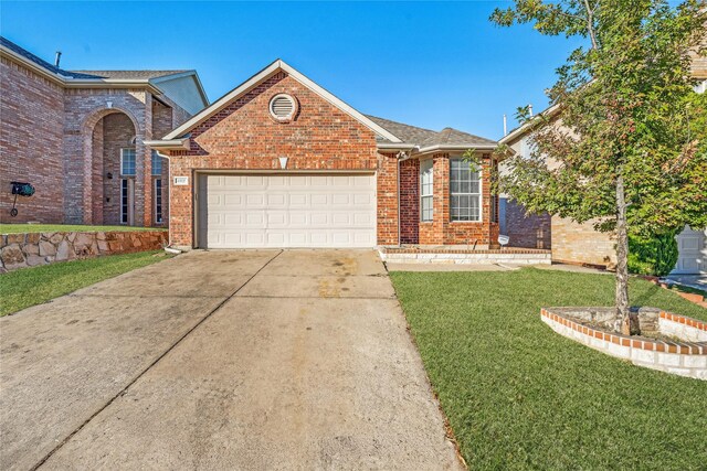 view of property with a front yard and a garage