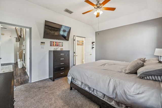 carpeted bedroom with ceiling fan and lofted ceiling