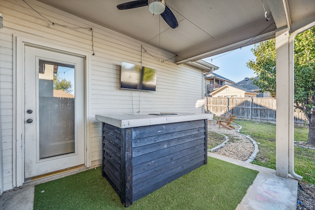 view of patio / terrace featuring ceiling fan