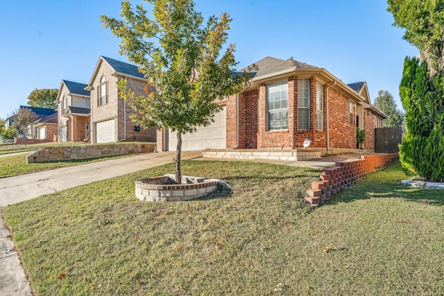 view of front of home with a garage and a front lawn