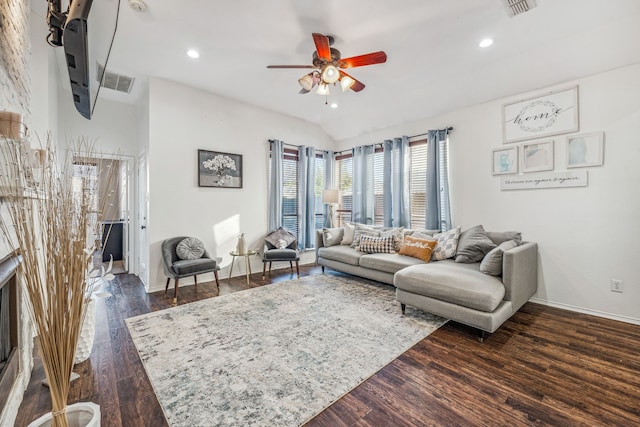 living room with vaulted ceiling, ceiling fan, and dark hardwood / wood-style flooring