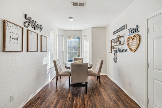 dining room featuring dark hardwood / wood-style floors