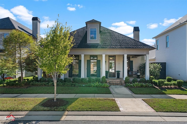 view of front of home featuring a porch and a front yard