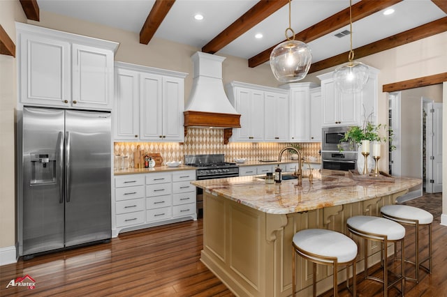 kitchen featuring decorative backsplash, white cabinetry, beamed ceiling, and stainless steel appliances