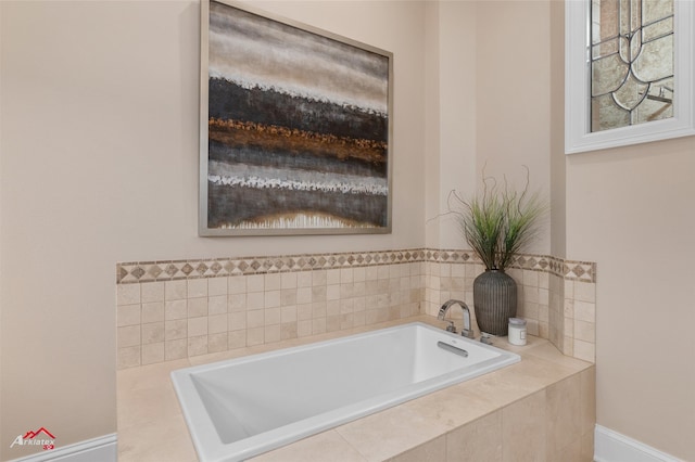 bathroom with tiled tub