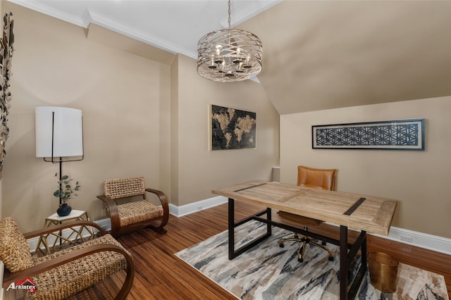 home office featuring hardwood / wood-style flooring, lofted ceiling, ornamental molding, and an inviting chandelier