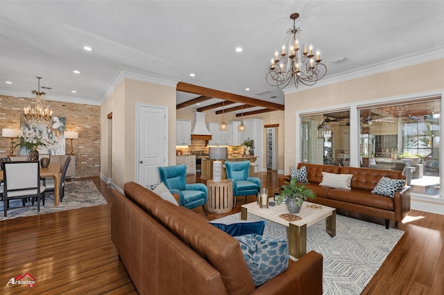 living room featuring hardwood / wood-style flooring, ceiling fan with notable chandelier, crown molding, and beamed ceiling