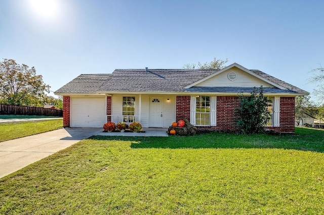 ranch-style house with a garage and a front lawn