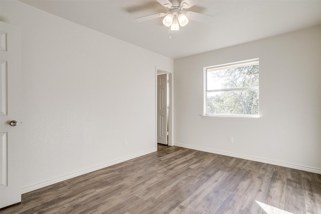 empty room featuring wood-type flooring and ceiling fan