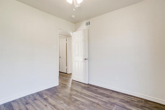 spare room featuring ceiling fan and wood-type flooring