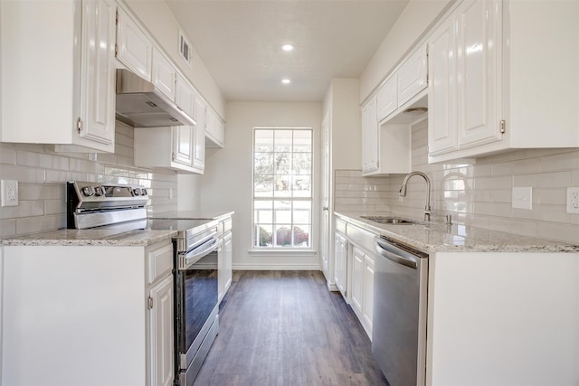 kitchen with white cabinets, dark hardwood / wood-style flooring, stainless steel appliances, and sink