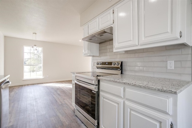 728 E 3rd St, Springtown, TX 76082 - kitchen featuring stainless steel appliances, under cabinet range hood, tasteful backsplash, white cabinets, and light wood-type flooring