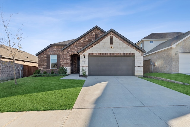 view of front of home featuring a front yard and a garage